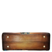 A brown genuine leather Wide Organizer Satchel - 695 by Anuschka isolated on a white background.