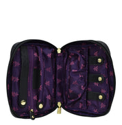 Open Anuschka black wallet with purple floral interior and zippered wall pocket.