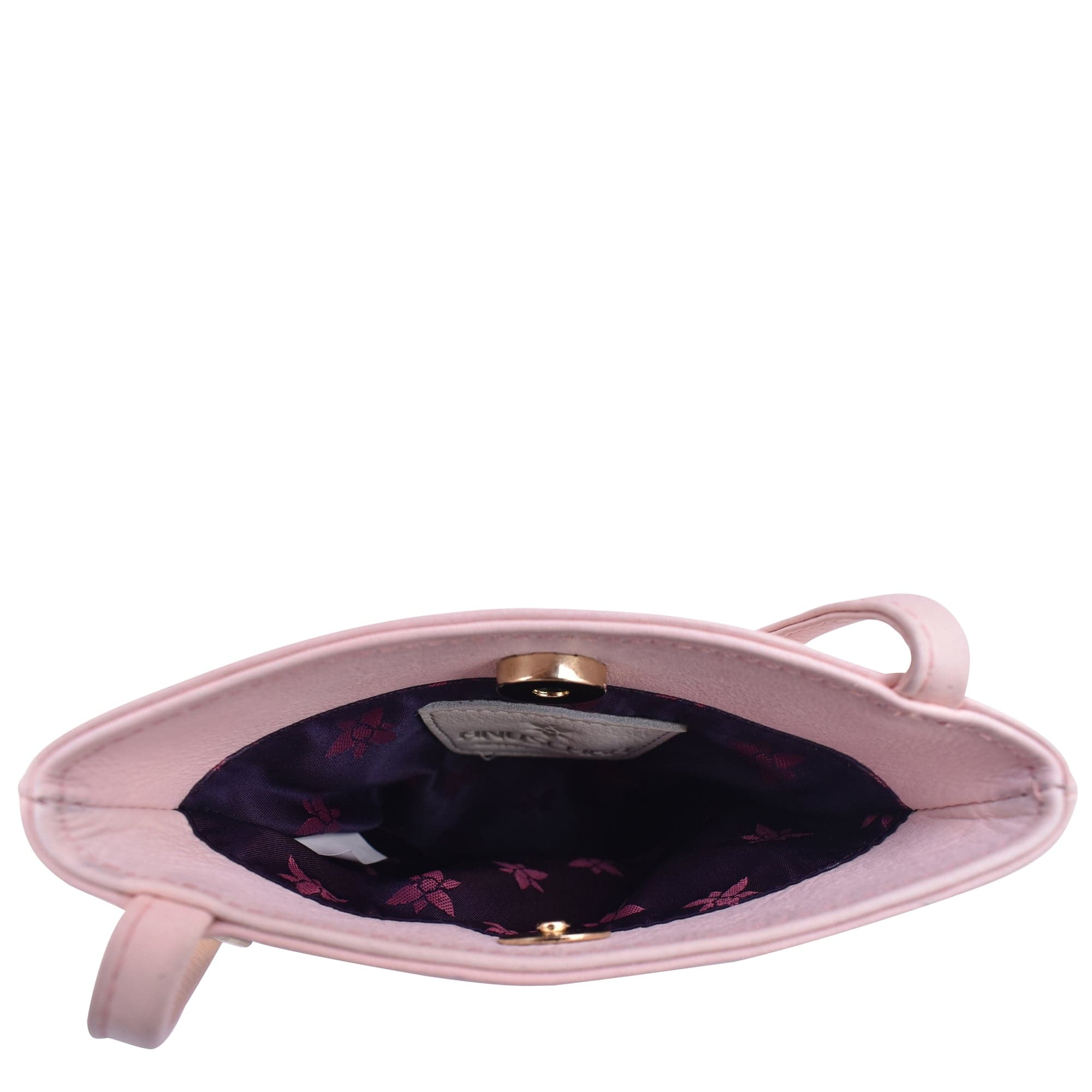An open, empty pink Anuschka Mini Double Zip Travel Crossbody - 448 genuine leather purse showing the interior lining and clasp closure.