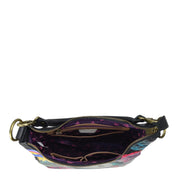 Anuschka Convertible Slim Hobo With Crossbody Strap - 662 with zippered pockets isolated on a white background.