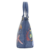 Blue genuine leather Anuschka handbag with marine life print design.