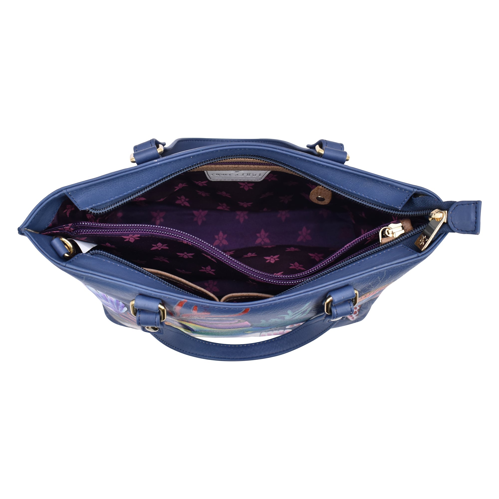Open Anuschka blue genuine leather Medium Tote - 693 with floral-patterned interior.