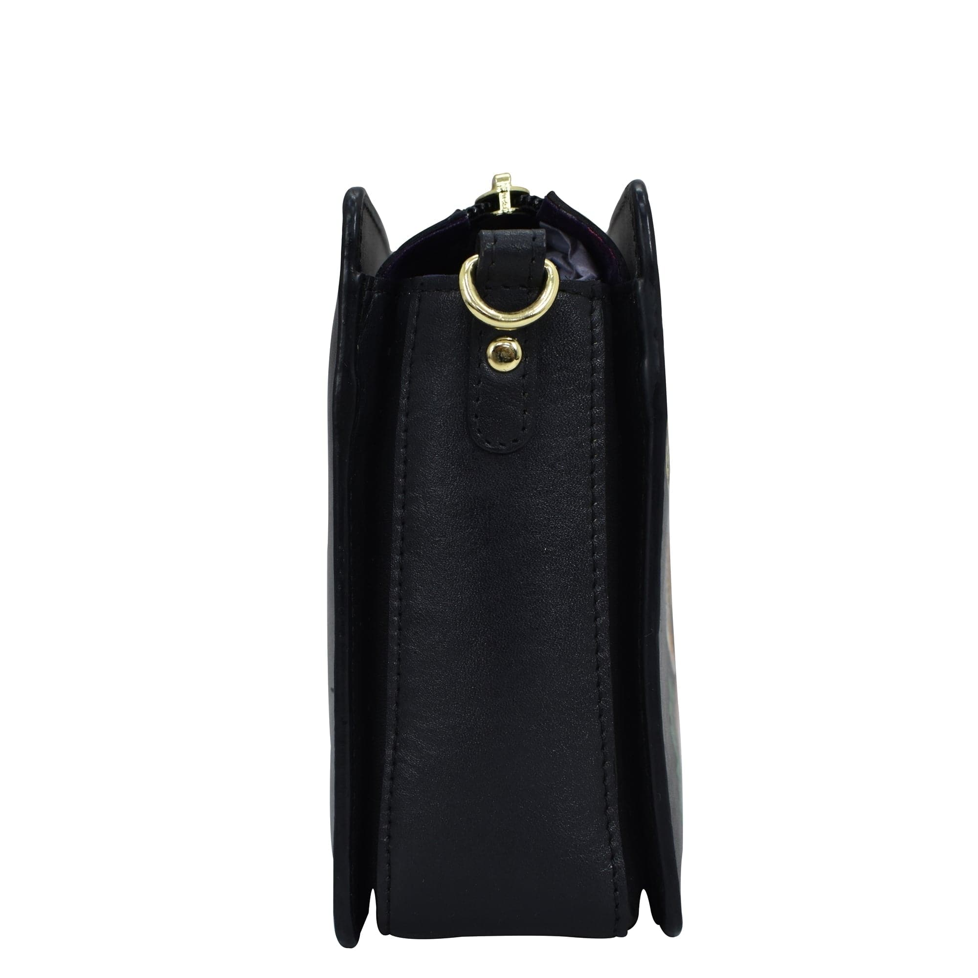 Side view of a black leather Triple Compartment Crossbody - 696 handbag by Anuschka with a gold-tone ring handle and multiple compartments.
