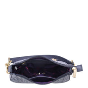 An open grey Anuschka Small Convertible Hobo - 701 showcasing its interior and contents.