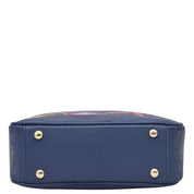Navy blue Anuschka Twin Top Messenger - 704 with floral patterns and metal stud details, RFID protected, on a white background.