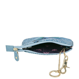 Blue Medium Zip Pouch - 1107 with a floral pattern partially unzipped, revealing interior lining, attached to a gold-tone keychain with a clip. Ideal for gifts by Anuschka.