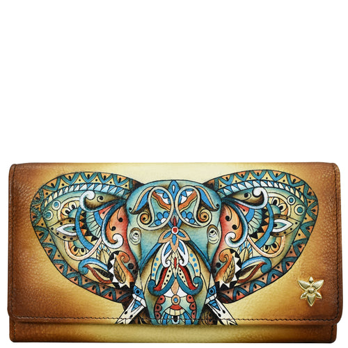 An Anuschka Accordion Flap Wallet - 1112 featuring a colorful, ornate elephant head design on the front flap, embodying boho elegance while offering RFID protection.