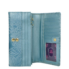 Load image into Gallery viewer, Open Anuschka light blue floral-patterned genuine leather Accordion Flap Wallet - 1112 with card slots, a transparent ID holder, and RFID protection.
