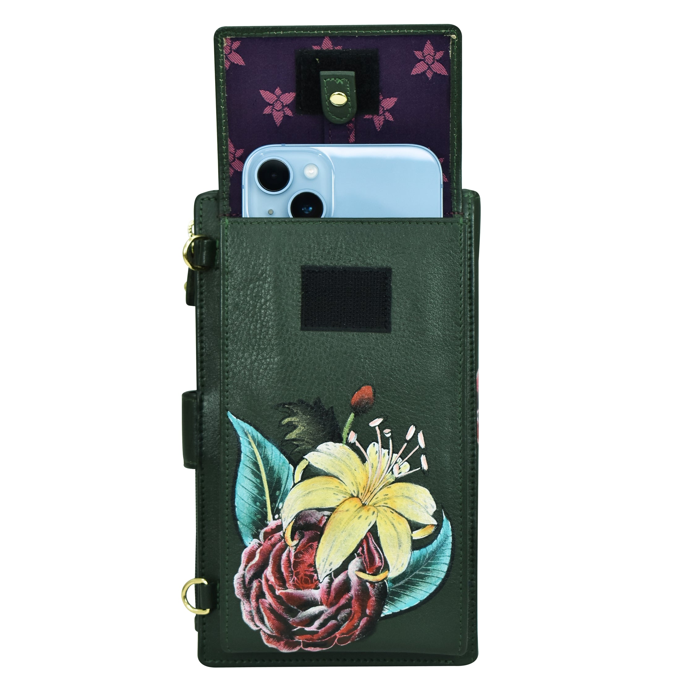 An Anuschka Cell Phone Case & Wallet - 1113 in green genuine leather with a floral design holds a blue phone. The case is open, revealing a purple interior with a button closure.