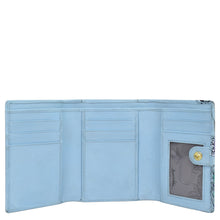 Load image into Gallery viewer, Anuschka&#39;s RFID Blocking Small Flap French Wallet - 1138, a light blue trifold design crafted from genuine leather, features multiple card slots, an ID window, and a snap button closure.
