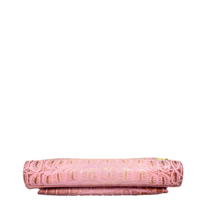 Patterned pink rolling pin resting horizontally on a white surface with a white background, akin to genuine leather Anuschka Organizer Wallet Crossbody - 1149.