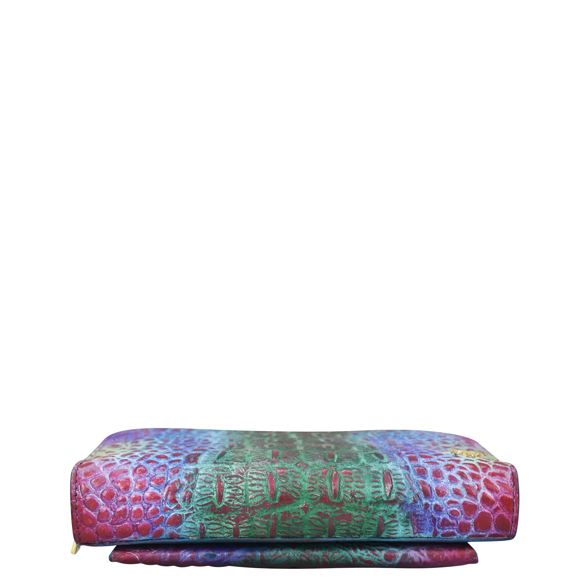 Anuschka Multicolored patterned bolster pillow with RFID protection on a white background.