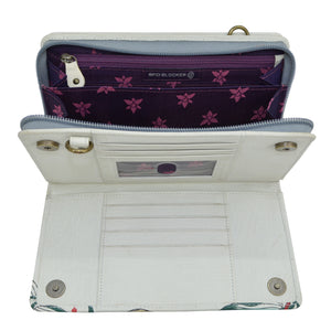 An open, empty white Anuschka Organizer Wallet Crossbody - 1149 with RFID protection and floral interior design.