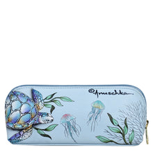 Load image into Gallery viewer, A light blue Anuschka genuine leather Medium Zip-Around Eyeglass/Cosmetic Pouch - 1163 featuring a hand-painted illustration of a turtle and jellyfish with a zip-around closure.
