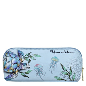 A light blue Anuschka genuine leather Medium Zip-Around Eyeglass/Cosmetic Pouch - 1163 featuring a hand-painted illustration of a turtle and jellyfish with a zip-around closure.