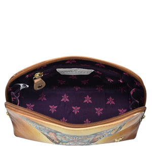 An open Large Cosmetic Pouch - 1164 by Anuschka displaying a purple interior with a floral pattern and beauty essentials.