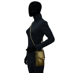 Mannequin displaying a Crossbody Phone Case - 1173 by Anuschka and wearing a dark outfit with a high neckline, black gloves, and an RFID clutch.