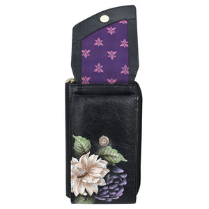 A Crossbody Phone Case - 1173 from Anuschka with a floral design, RFID card holders, and a purple interior.