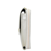 Side view of a white zippered Crossbody Phone Case - 1173 with RFID card holders against a white background by Anuschka.