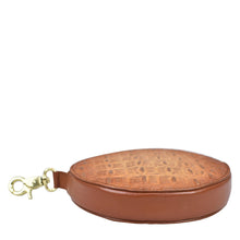 Load image into Gallery viewer, Brown genuine leather round coin purse with clasp isolated on white background by Anuschka.
