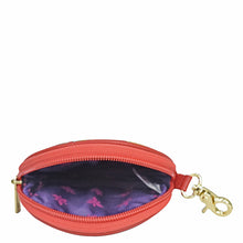 Load image into Gallery viewer, Open red Anuschka Round Coin Purse - 1175 with a floral patterned interior and a gold zipper pull, isolated on a white background.
