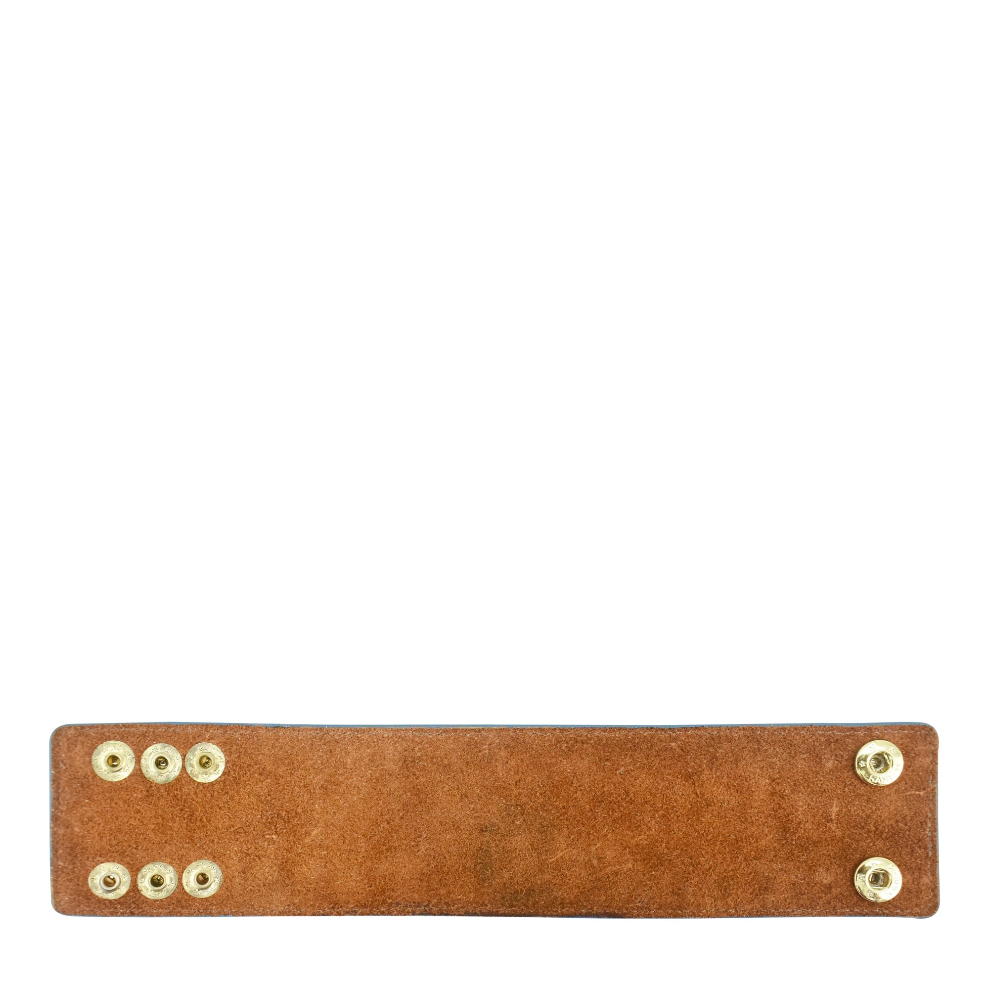 A Painted Leather Cuff - 1176 by Anuschka with antique brass snap buttons against a white background.