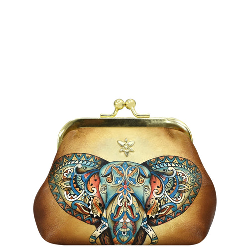 Vintage-style Anuschka leather clutch purse with an ornate elephant design on a white background.