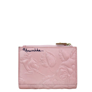 Pink embossed Anuschka Two Fold Organizer Wallet - 1178 with floral pattern and brand logo.