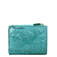 Load image into Gallery viewer, Teal genuine leather Two Fold Organizer Wallet - 1178 with embossed floral design and Anuschka brand logo.
