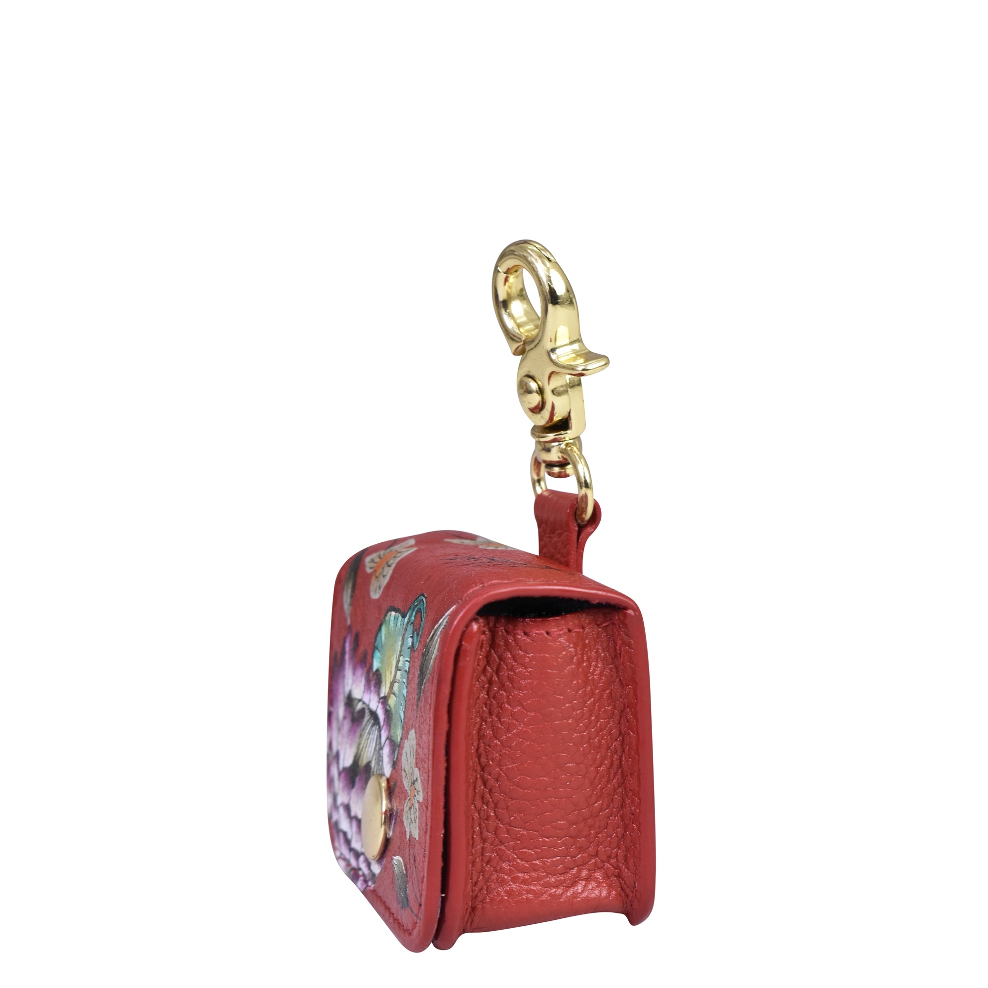 A small, genuine leather keychain pouch with a gold clasp and floral design on the side, perfect for holding your Airpod Pro Case - 1179 by Anuschka.