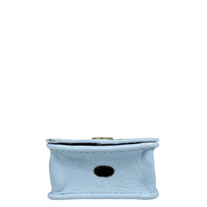 A small, light blue genuine leather pouch with a button closure on the top and a circular hole in the front, perfect for an Anuschka Airpod Pro Case - 1179.