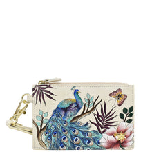 Load image into Gallery viewer, A Anuschka Card Holder with Wristlet - 1180 with RFID protection and a printed design featuring a peacock and floral elements.
