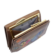 The Anuschka Two Fold French Wallet - 1181 is a brown genuine leather wallet adorned with a floral design, featuring a snap closure and multiple compartments, including an inner pouch with golden clasps. This elegant piece also boasts hand-painted artwork and a French clasp coin pocket for added charm.