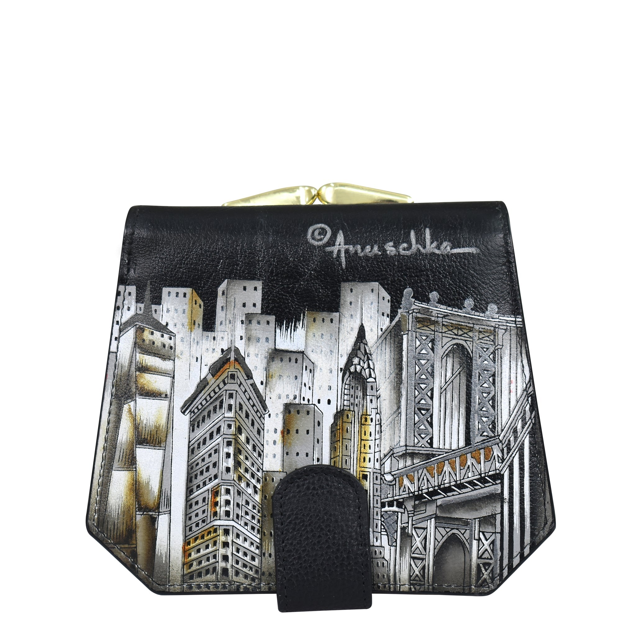 The Anuschka Two Fold French Wallet - 1181 is a black genuine leather wallet that showcases a detailed, hand-painted cityscape with buildings and a bridge, signed "Anuschka" at the top.