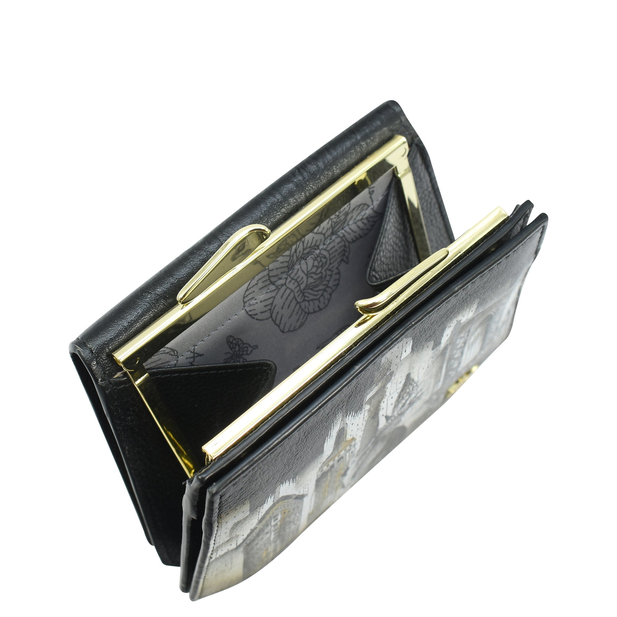 A Two Fold French Wallet - 1181 by Anuschka, crafted from genuine leather and featuring an exquisite black exterior with a vibrant floral pattern inside. This elegant piece is partially open to showcase multiple compartments and a chic French clasp, perfectly blending sophistication with practicality.