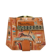 The Two Fold French Wallet - 1181 by Anuschka is a hand-painted brown leather wallet adorned with Egyptian-themed artwork and various symbols. Elegantly inscribed with "Anuschka" on the front, this genuine leather wallet includes eleven card holders, a clasp at the top, and a snap closure at the bottom.