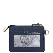 The CARD CASE - 1183 by Anuschka is a navy blue genuine leather cardholder that features a zippered coin pocket and a transparent ID window displaying a floral patterned card with text. It also comes with RFID protection, along with a gold-tone zipper and keyring attachment.