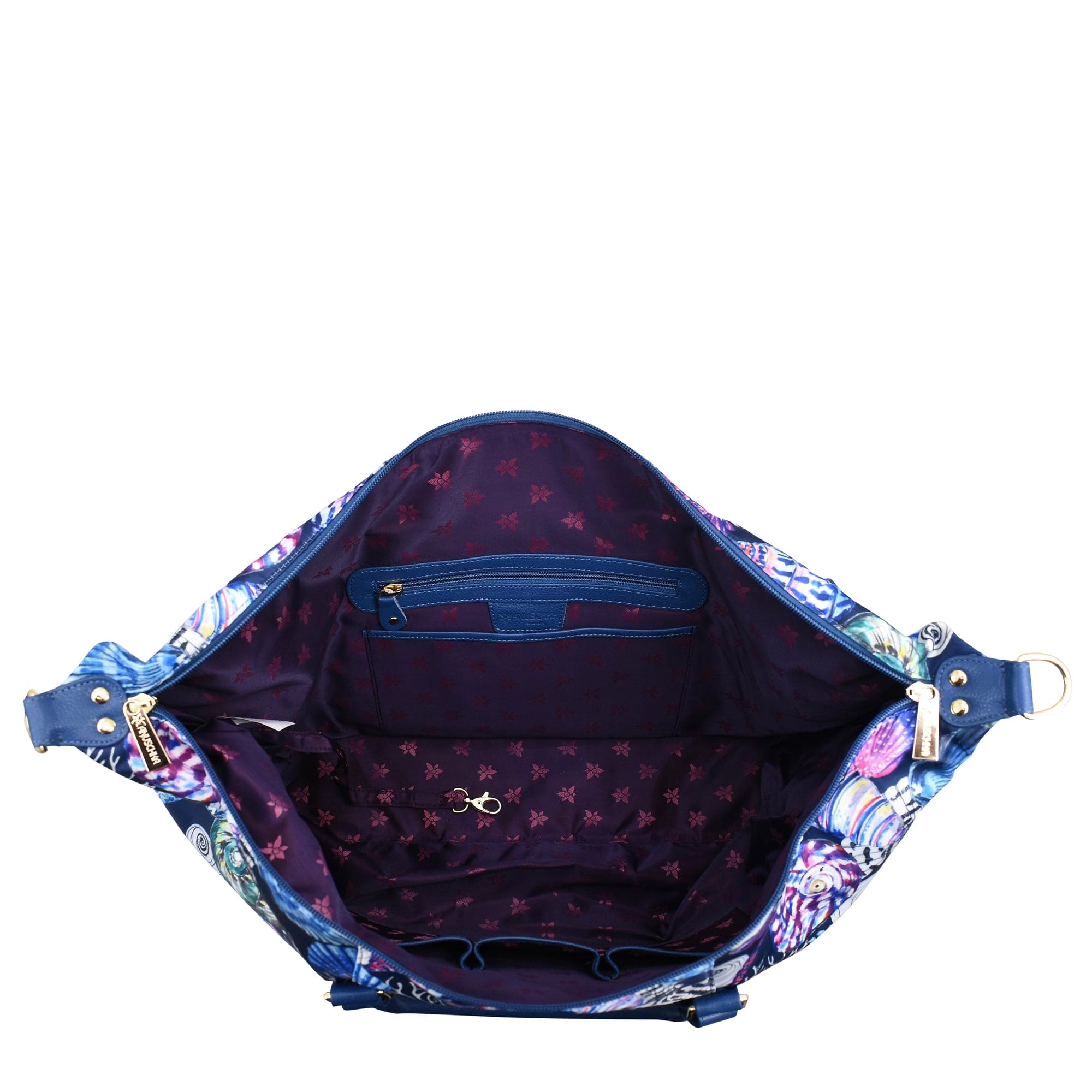 An Anuschka Fabric with Leather Trim Great Escape Duffle - 12016, with a floral inner lining, showcasing an inner zip compartment and a crossbody strap.