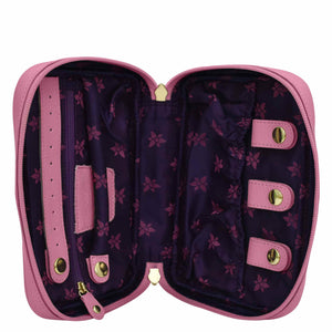 Open Anuschka pink leather trim travel jewelry organizer with empty compartments, partition pocket, and floral interior design.