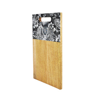 Wooden Printed Cutting Board made from mango wood with a black and white floral and leopard print design at the top by Anuschka.