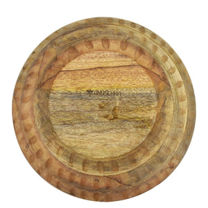 Round mango wood bowl with a natural grain pattern and a Anuschka logo in the center.