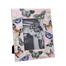 Load image into Gallery viewer, An Anuschka Wooden Printed Photo Frame - 25004 adorned with butterfly illustrations contains a black and white image of a person and a horse. This enamel frame adds a beautiful, glossy finish to the memorable capture.
