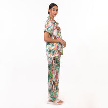 Load image into Gallery viewer, Woman modeling an Anuschka 3344 tropical print pajama set on a white background.
