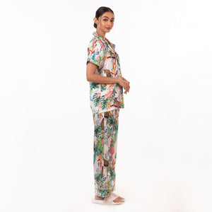 Woman modeling an Anuschka 3344 tropical print pajama set on a white background.