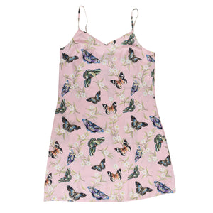 Sleeveless pink slip dress with butterfly print design and adjustable shoulder straps, isolated on white background. (Product Name: Anuschka Slip Dress - 3346)