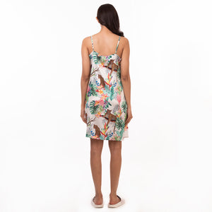 Woman standing facing away from the camera, wearing an Anuschka delicate prints slip dress - 3346.