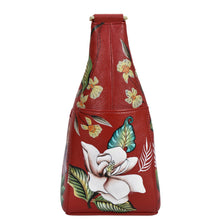 Load image into Gallery viewer, Red genuine leather Classic Hobo With Side Pockets - 382 handbag from Anuschka with floral pattern embossed on the side.
