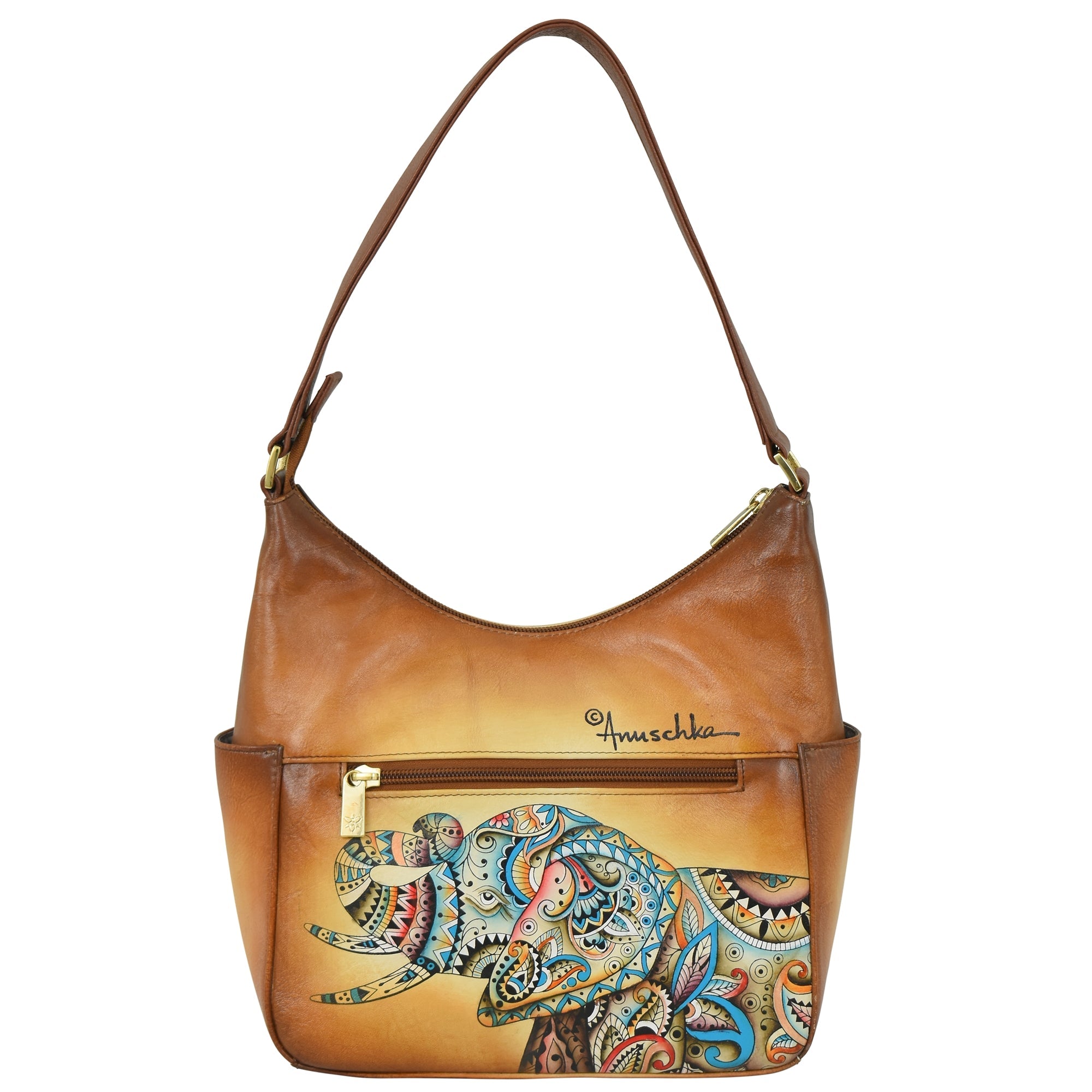 The Classic Hobo With Side Pockets - 382 by Anuschka features a genuine leather handbag accented with a hand-painted, colorful, patterned rhino design on the front pocket and an adjustable shoulder strap. The brand name "Anuschka" is printed prominently above the design.