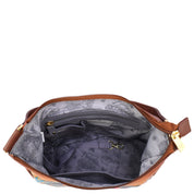 Top view of the Anuschka Classic Hobo With Side Pockets - 382, featuring a genuine leather exterior and a floral-patterned interior lining, revealing a zippered pocket, a key clip, and an open compartment.