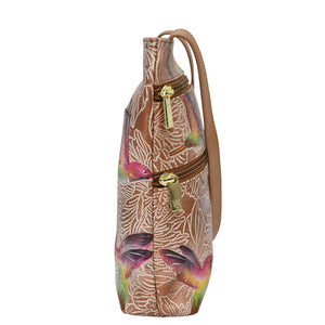 Printed backpack with tropical fish design, front zip pocket, and an adjustable shoulder strap.
Product Name: Medium Crossbody With Double Zip Pockets - 447
Brand Name: Anuschka